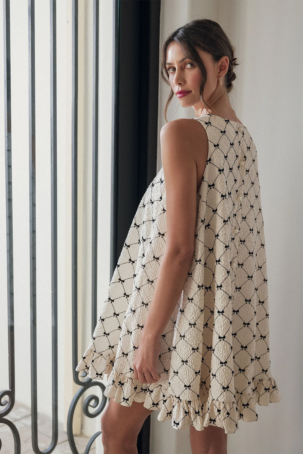 White Ruffled Sleeveless Mini Tent Dress with Black Bows