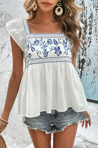 White with Blue Embroidered Bust Ruffled Sleeveless Tied Back Peplum Top