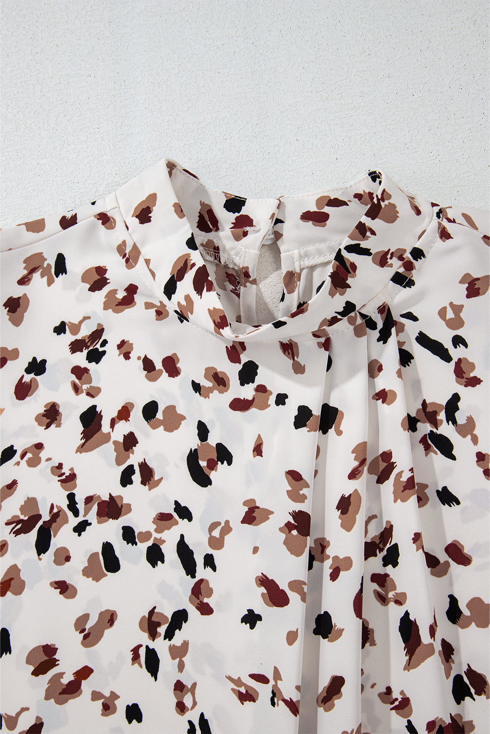 White with Brown & Black Confetti Print Lantern Sleeve Mock Neck Pleated Blouse