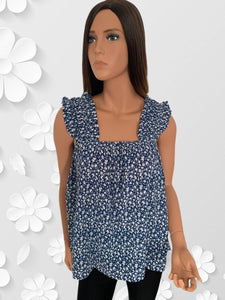 This beautiful floral babydoll is made with a cool cotton blend fabric. It features small white flowers on a navy base. Finished with a square elasticized neckline and elasticized straps with ruffle trim. Perfect piece for summer! Roomy and flowy top! 